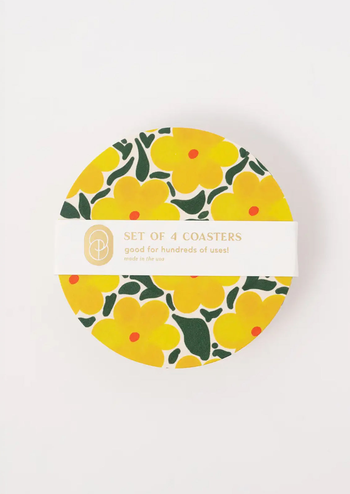 A paper coaster set with a yellow floral design.