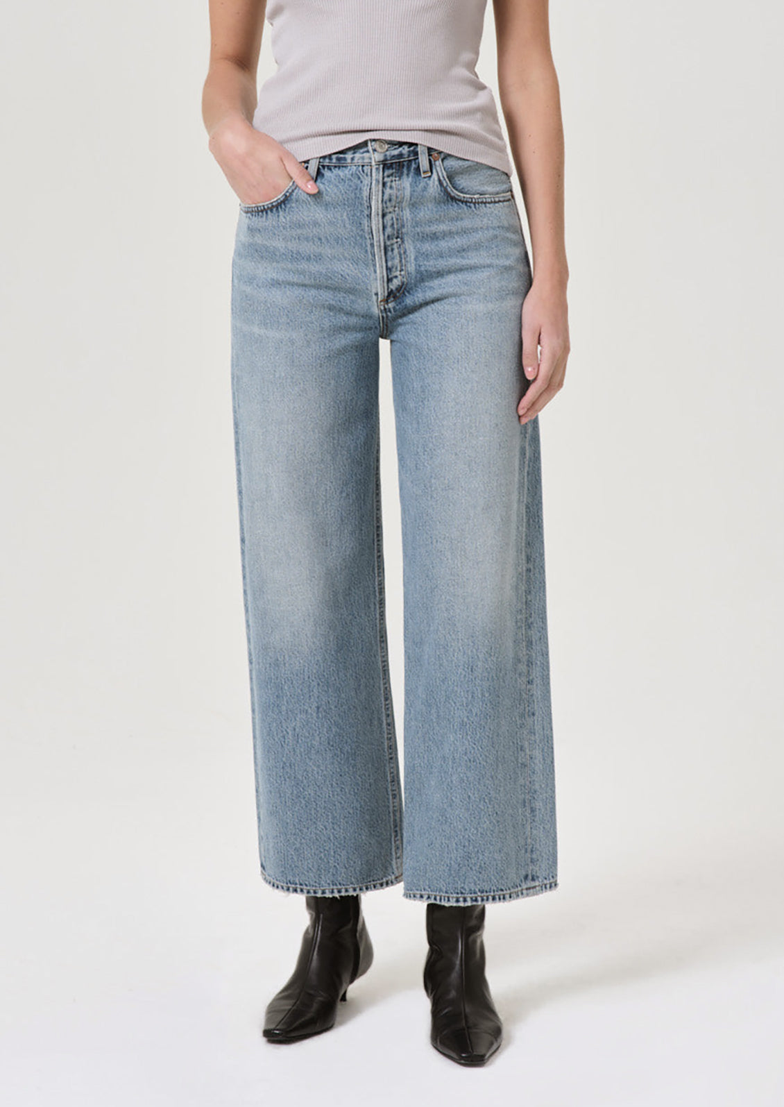 A pair of wide leg jeans in classic blue denim wash.