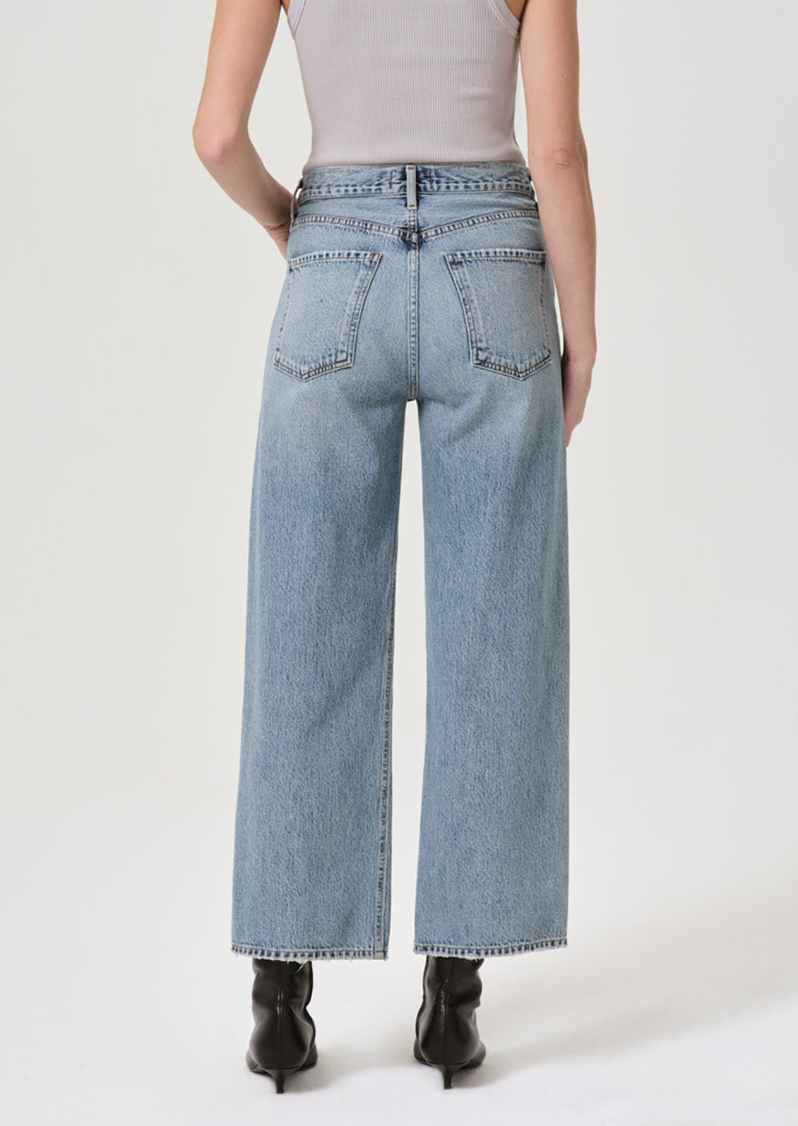 A pair of wide leg jeans in classic blue denim wash.