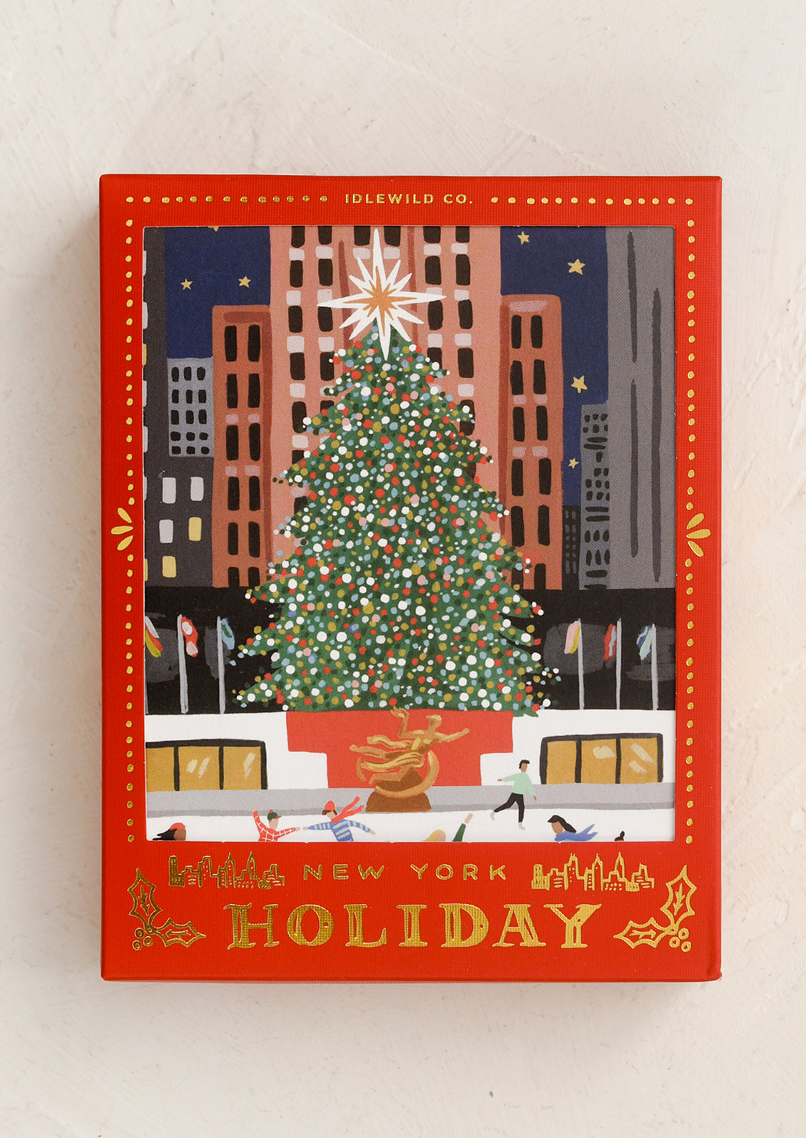 An illustrated card set with different holiday NYC scenes