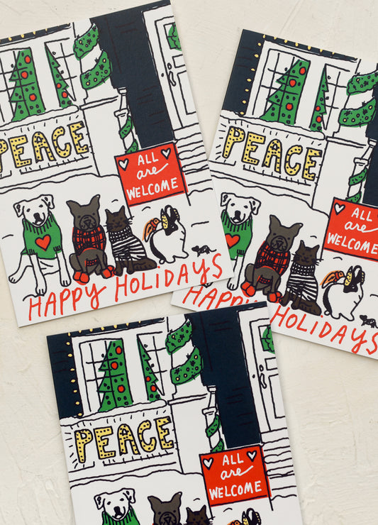 A set of illustrated cards with dogs and cats, text reads "All are welcome, Peace, Happy Holidays".