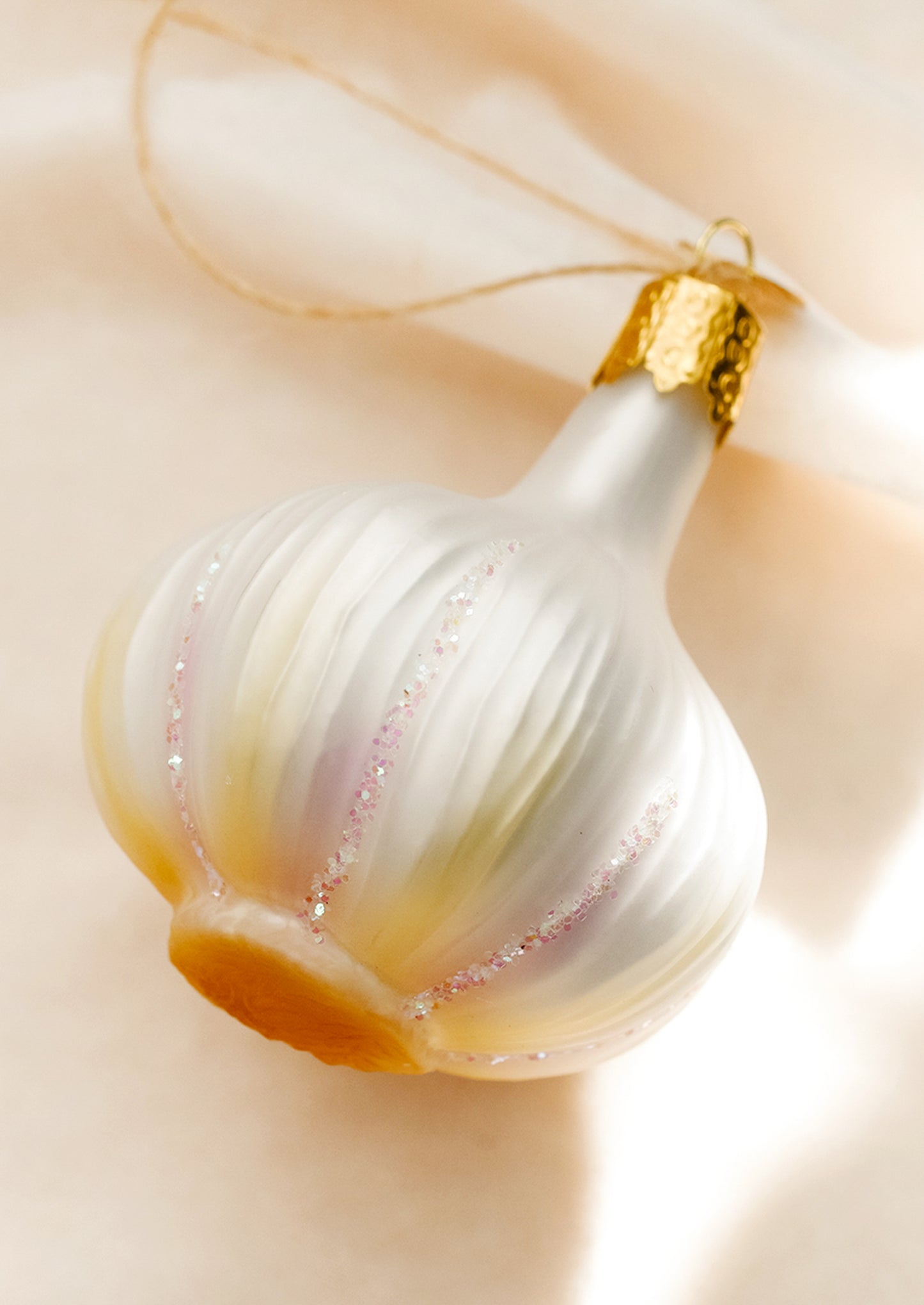 A glass ornament of a bulb of garlic.