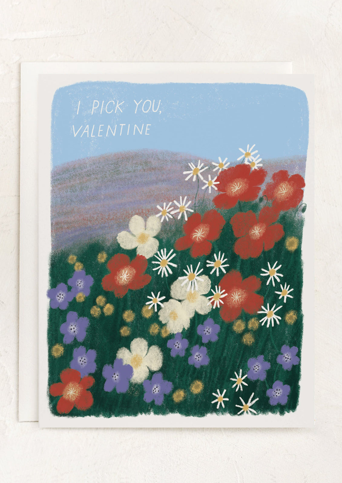 A card with illustration of flowers in a field, text reads "I pick you, Valentine".