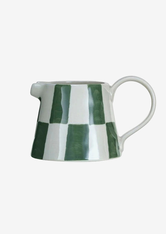 A small mini creamer pitcher with green check pattern.