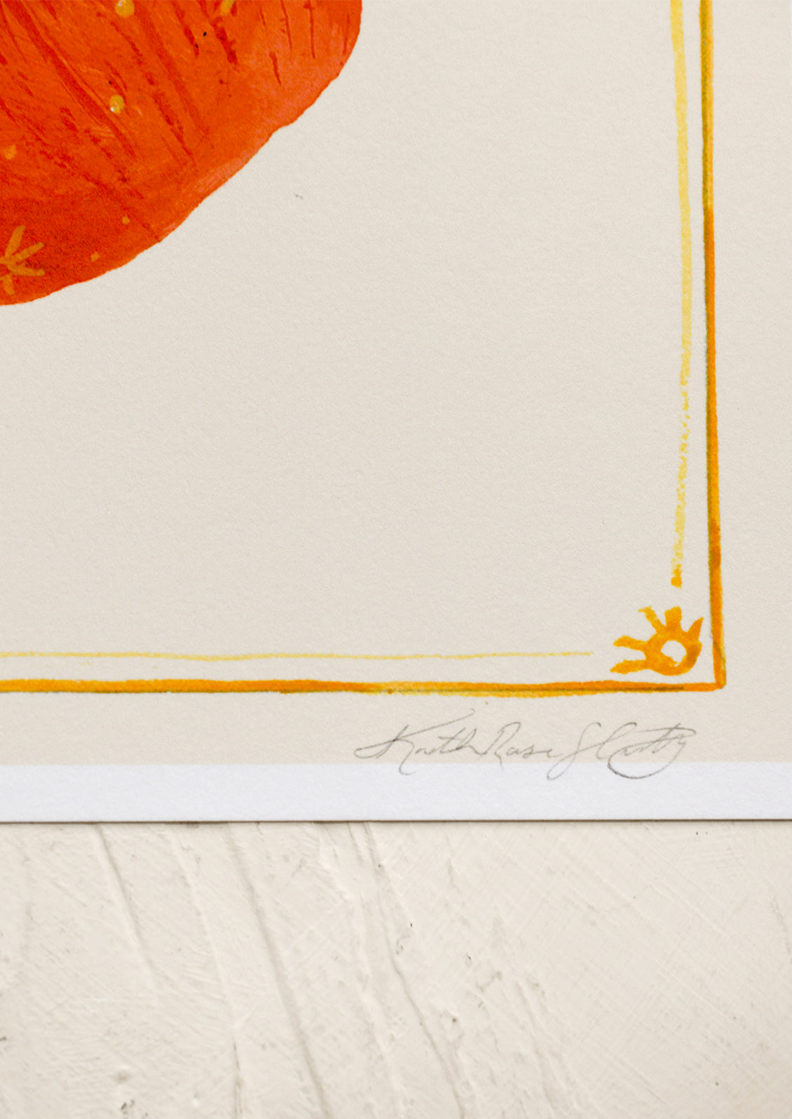 An art print of an apple with gold border.