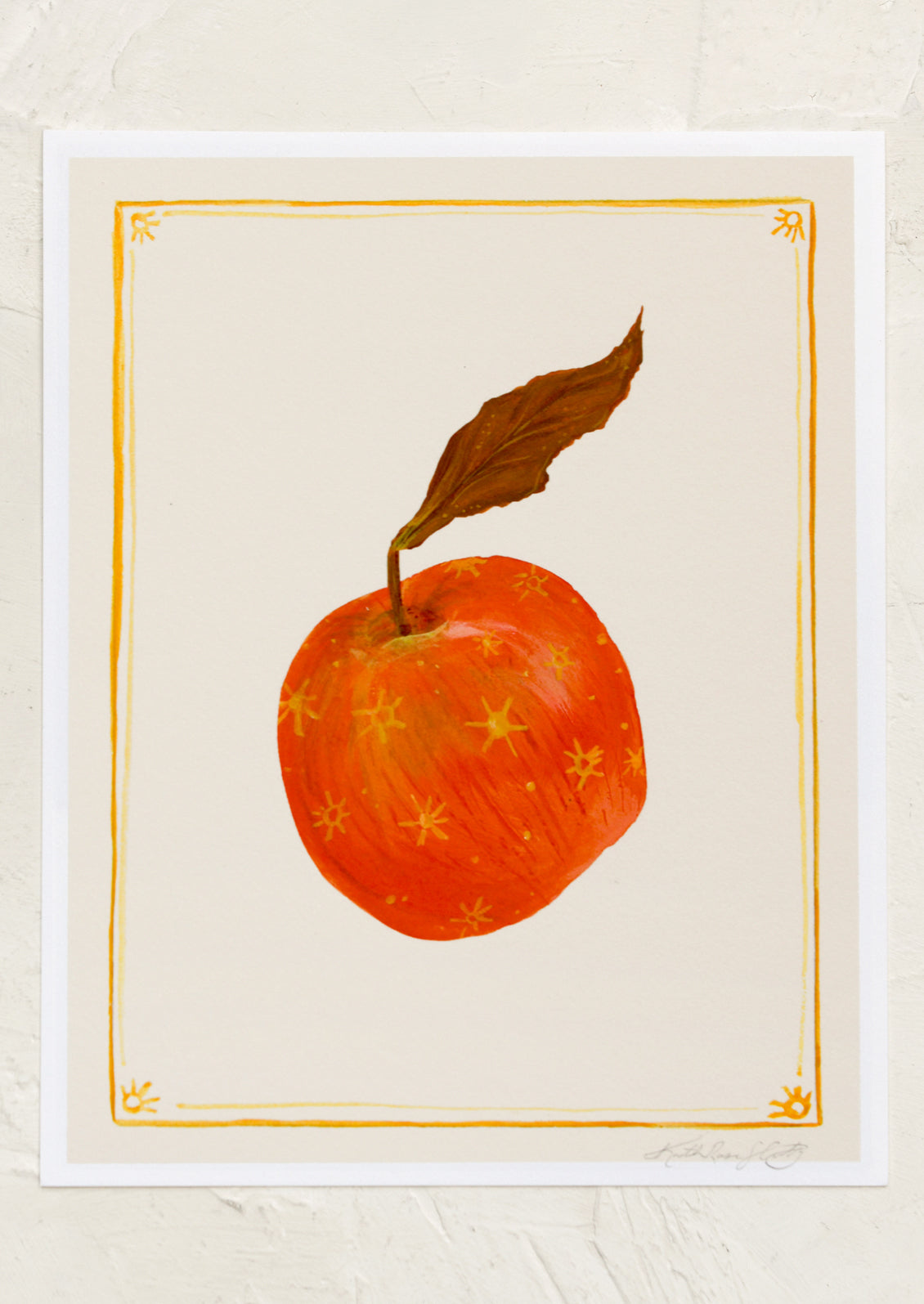 An art print of an apple with gold border.