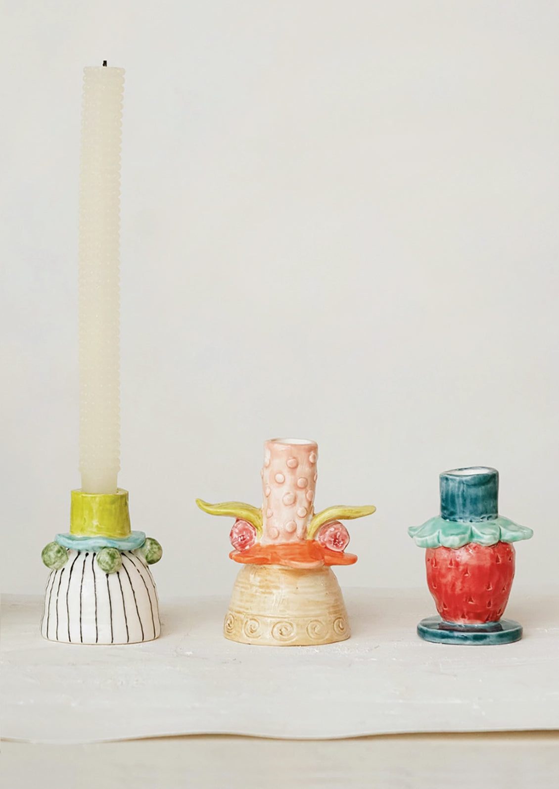 Playful, quirky and colorful candle holders in assorted shapes and sizes.