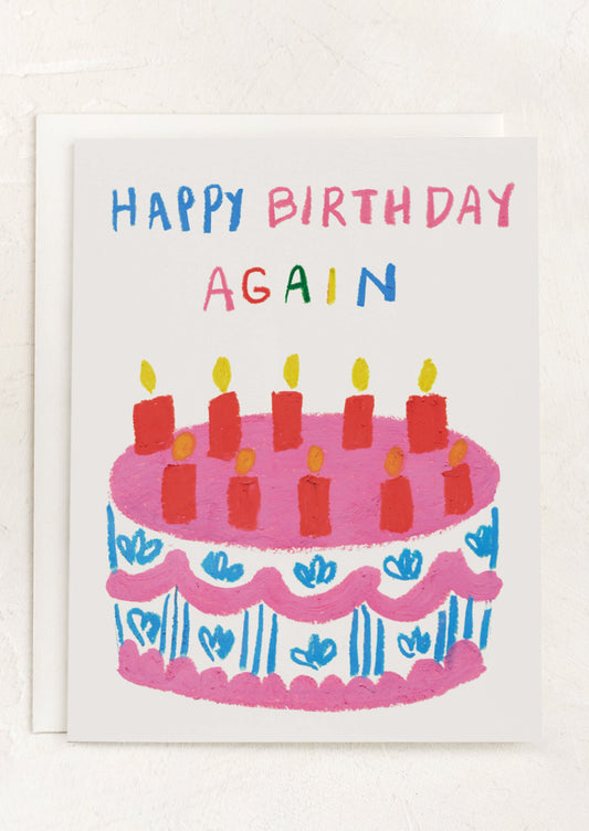 A card with illustration of birthday cake, text reads "Happy Birthday Again".