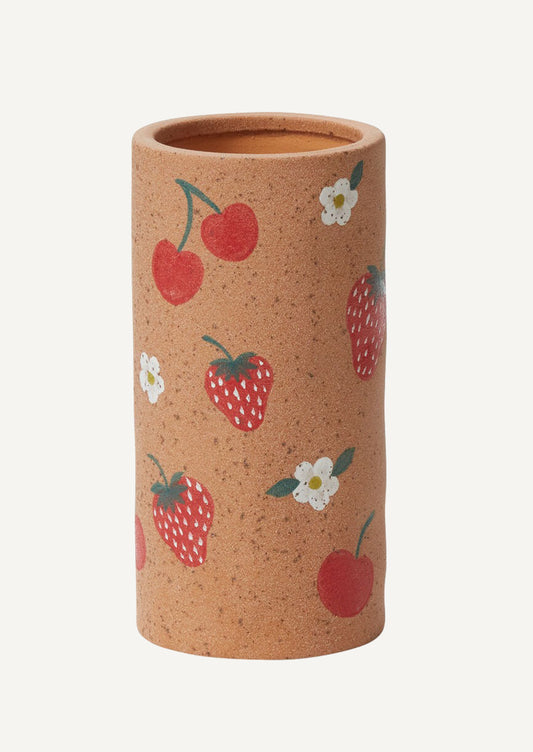 A sandy ceramic vase with painted berry pattern.