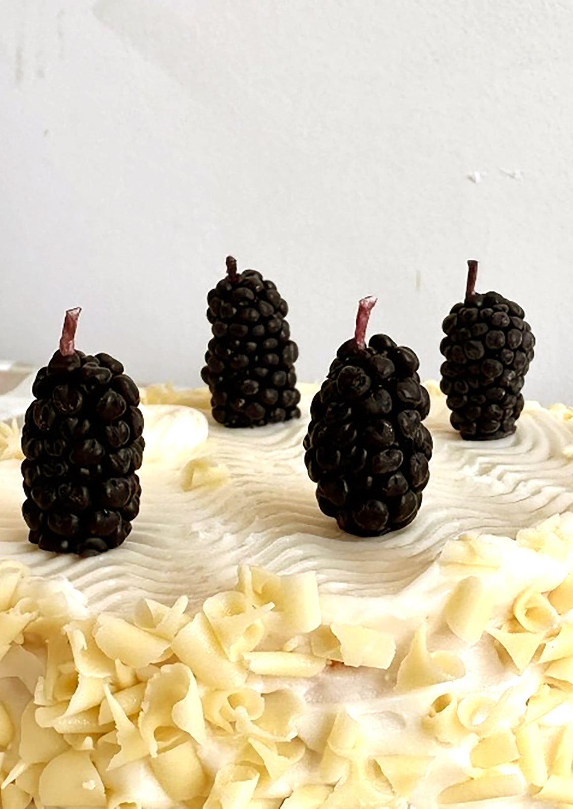 Birthday candles in the shape of blackberries.