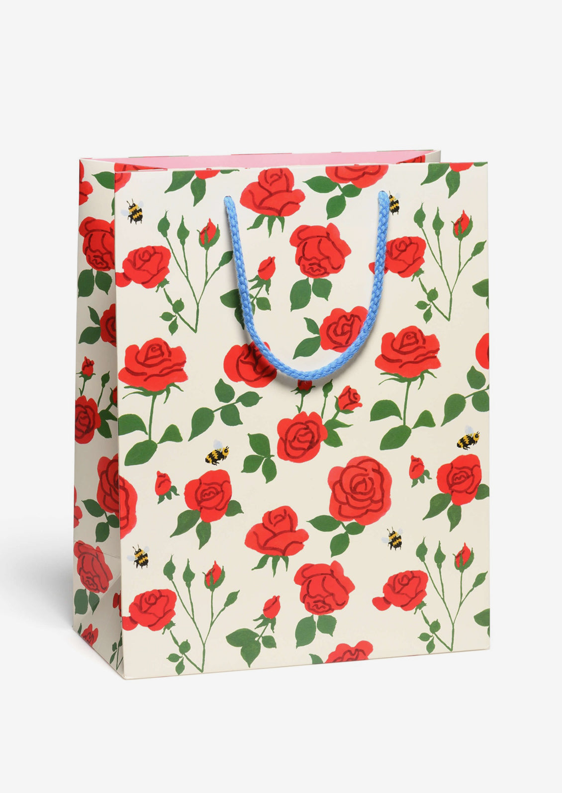 A printed gift bag with red rose print on white background.