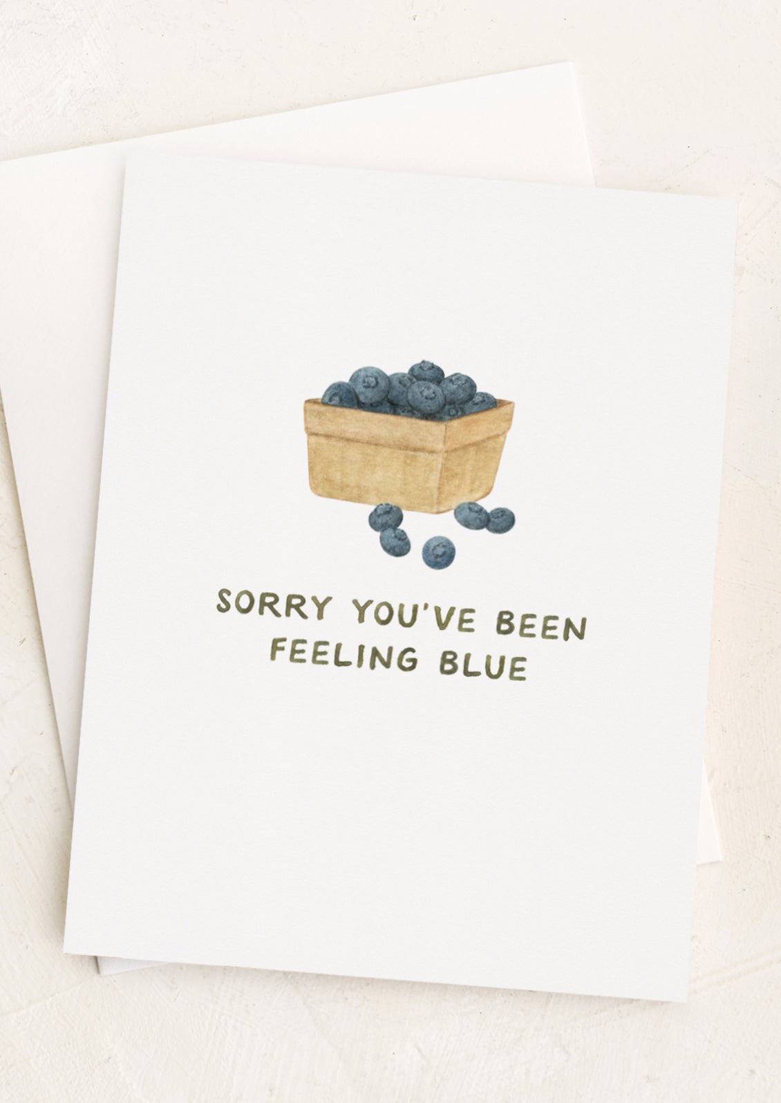 A card with image of blueberries, text reads "Sorry You've Been Feeling Blue".