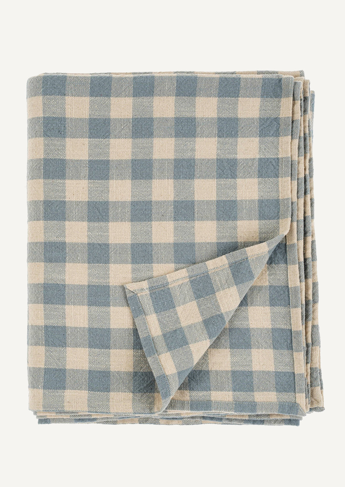 A cotton tablecloth in light blue and cream gingham.