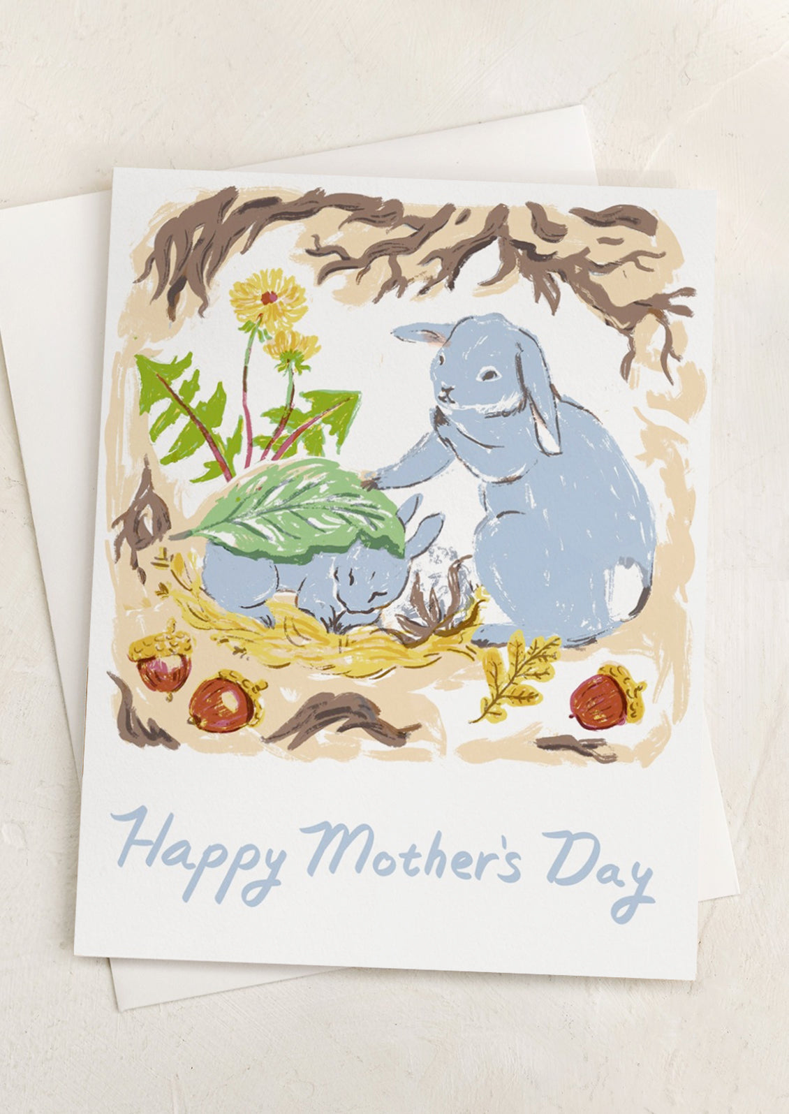 A card with illustration of bunnies, text reads "Happy Mother's Day.