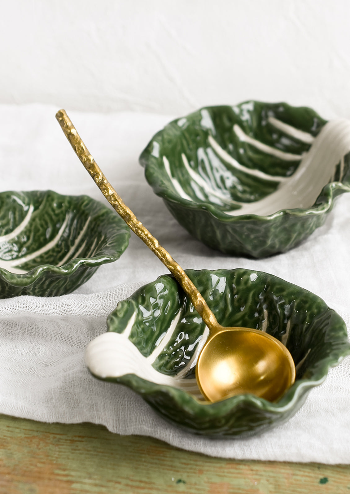 Cabbageware style ceramic bowls that look like green cabbage.