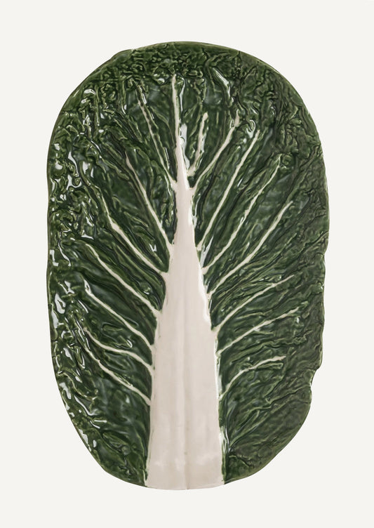 A ceramic serving "cabbageware" style platter that looks like green leaf of cabbage.