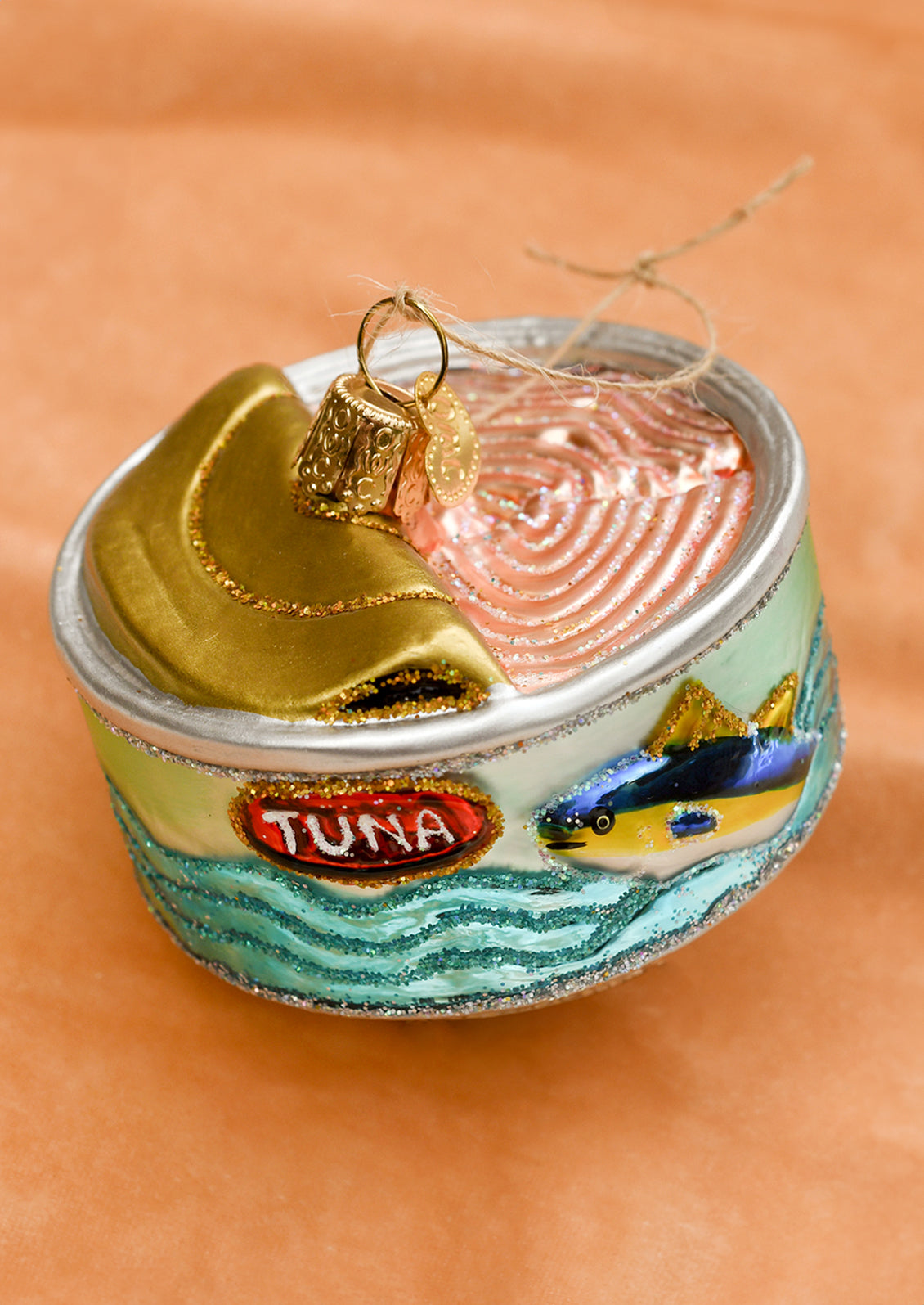 A glass ornament of a can of tuna.