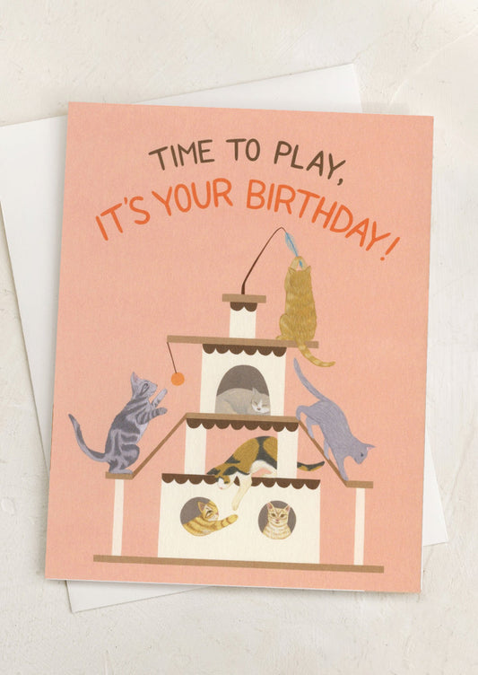 A card with illustration of cats playing, text reads "Time to play, it's your birthday!".