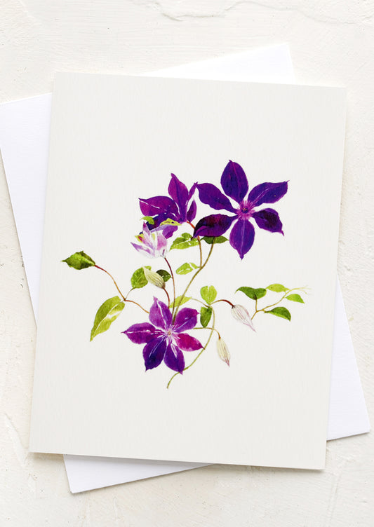 A greeting card with illustration of purple clematis.