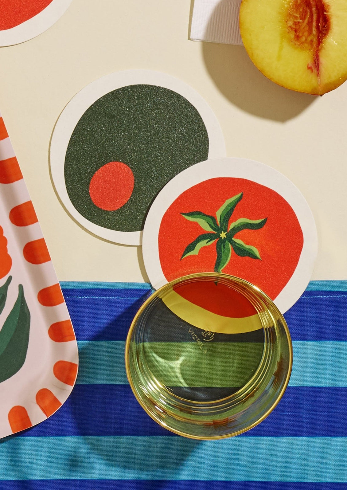 Paper coasters in olive and tomato variations.