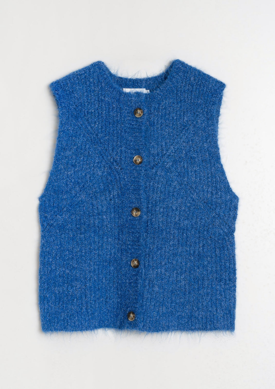 A sleeveless button front sweater vest in cobalt blue.