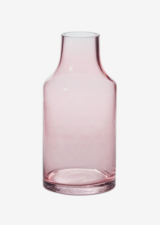 A transparent glass vase with blush hue.