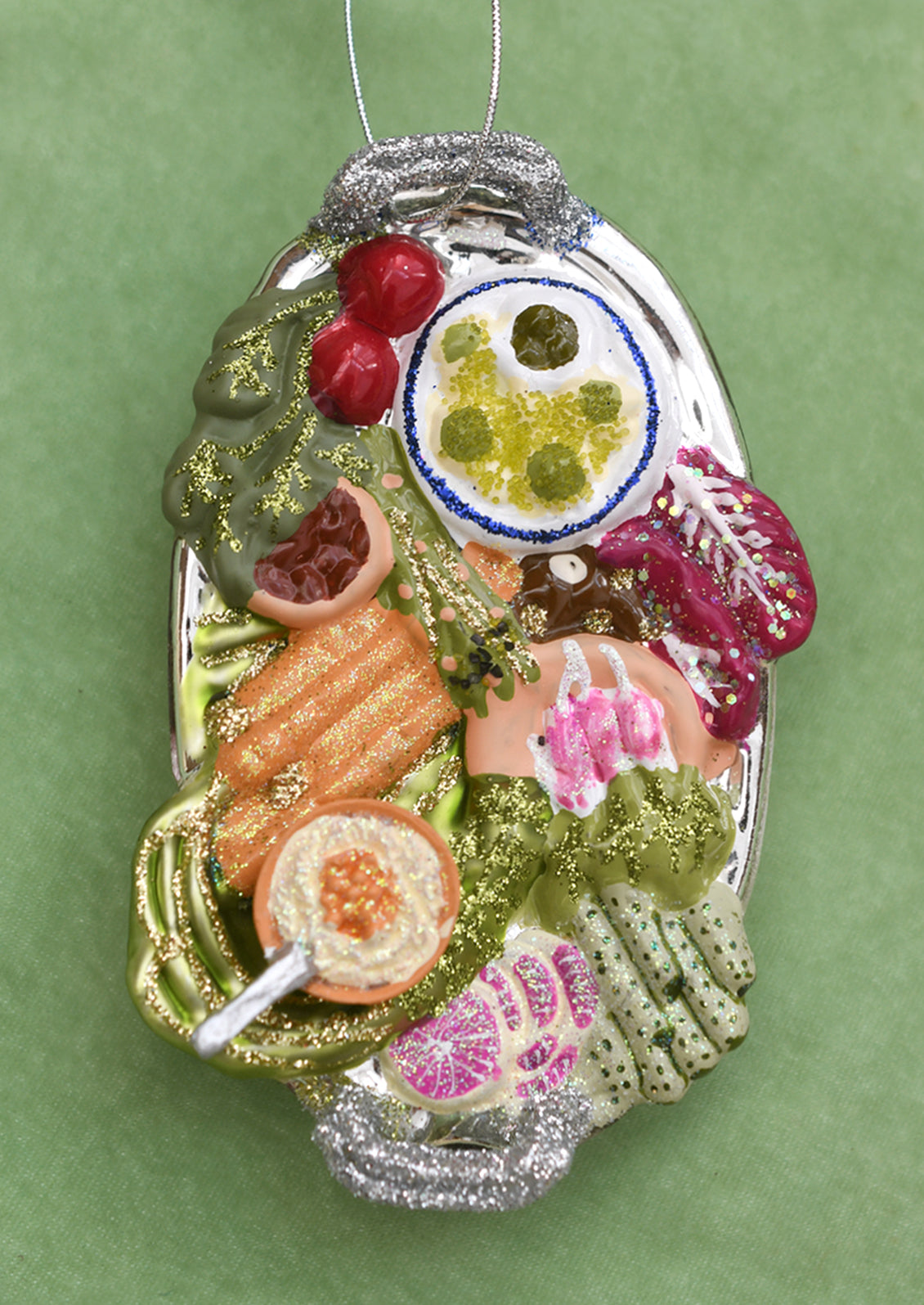 A glass ornament of a veggie crudite platter.