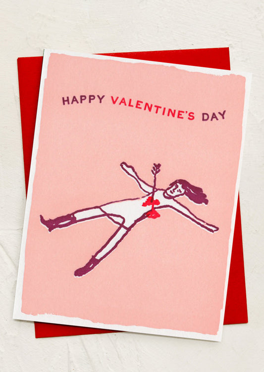 A card with illustration of person laying on the ground with arrow in heart, text reads "Happy Valentine's Day".