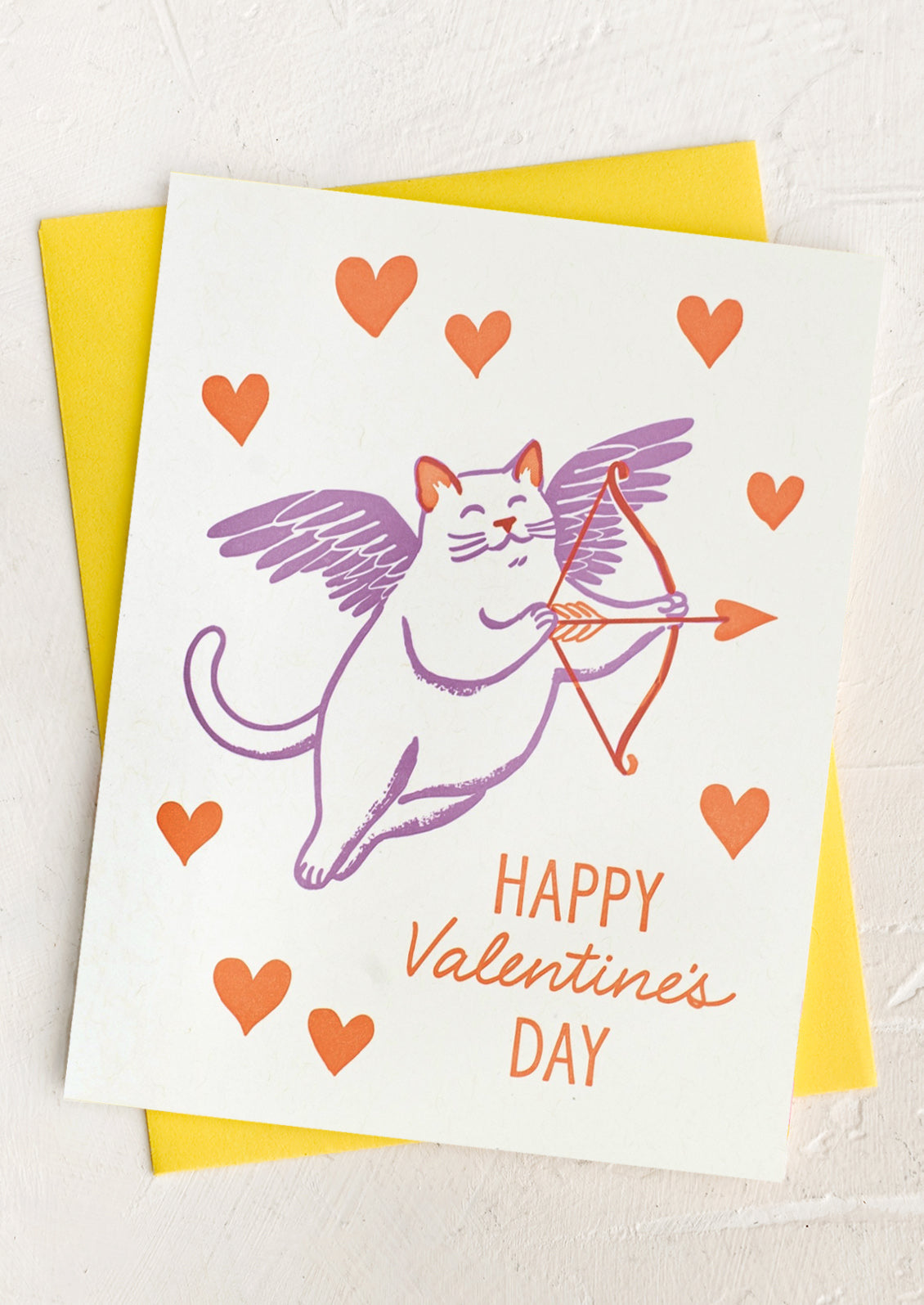 A card with image of cat as cupid, text reads "Happy Valentine's Day".