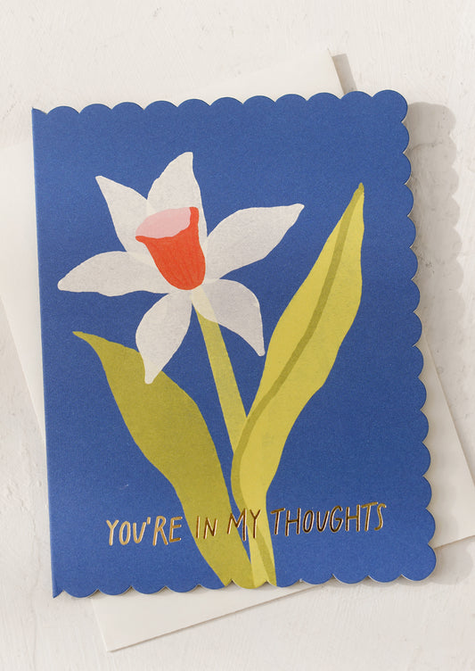 A blue card with daffodil, text reads "You're in my thoughts".