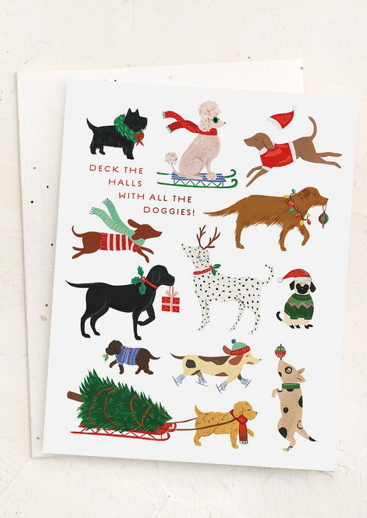 A dog print card reading "Deck the halls with all the doggies".