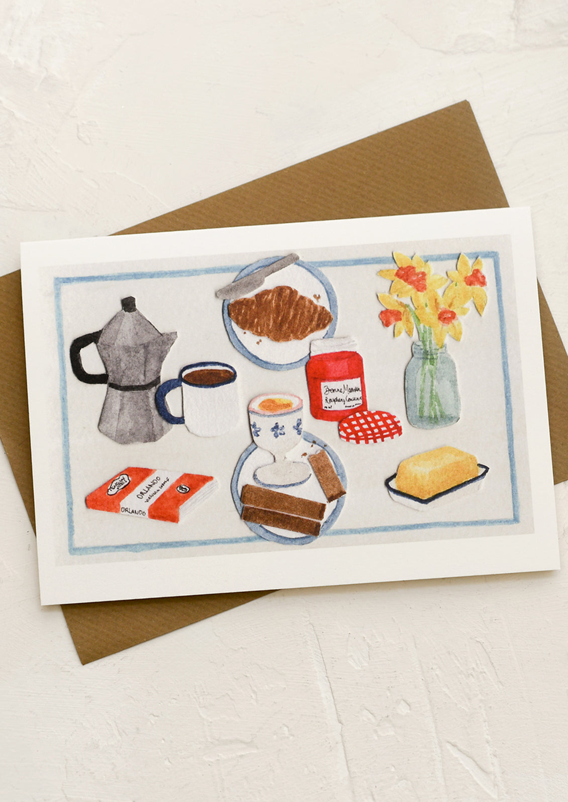 A greeting card with collage still life scene of breakfast items.