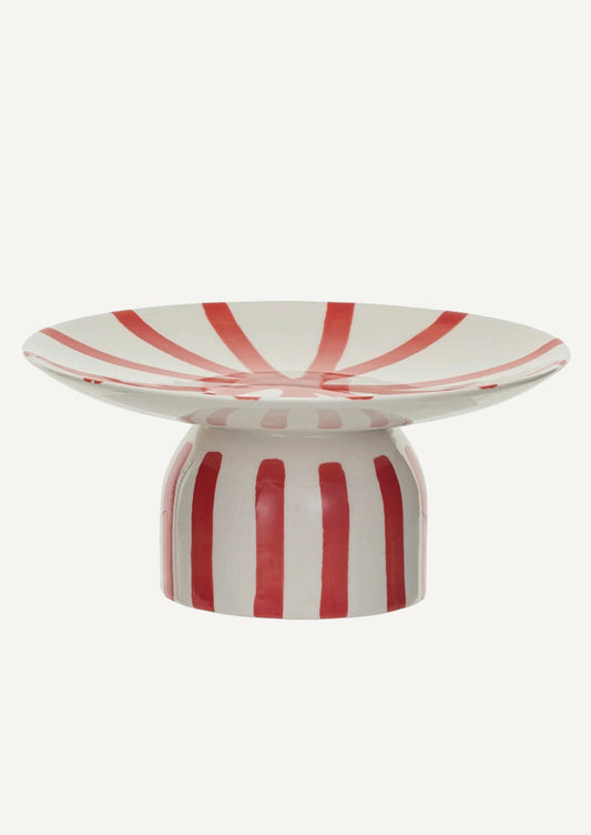 A footed ceramic pedestal in white with red stripes.