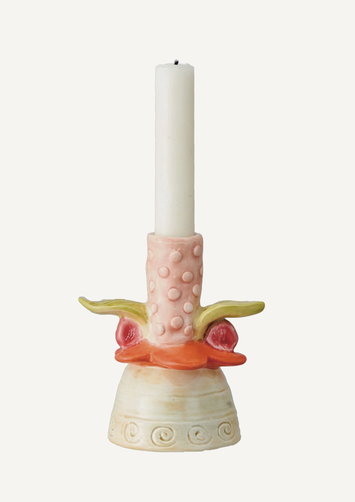 A ceramic candle holder with playful look, roughly in the shape of orange and pink flower.