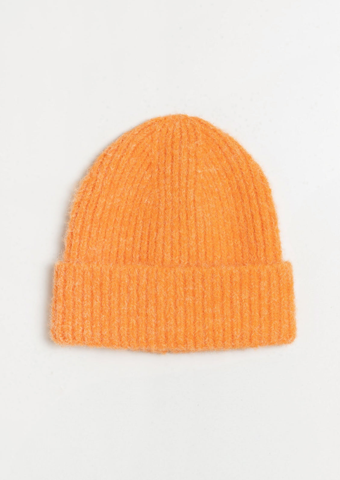 A fuzzy mohair beanie in orange.