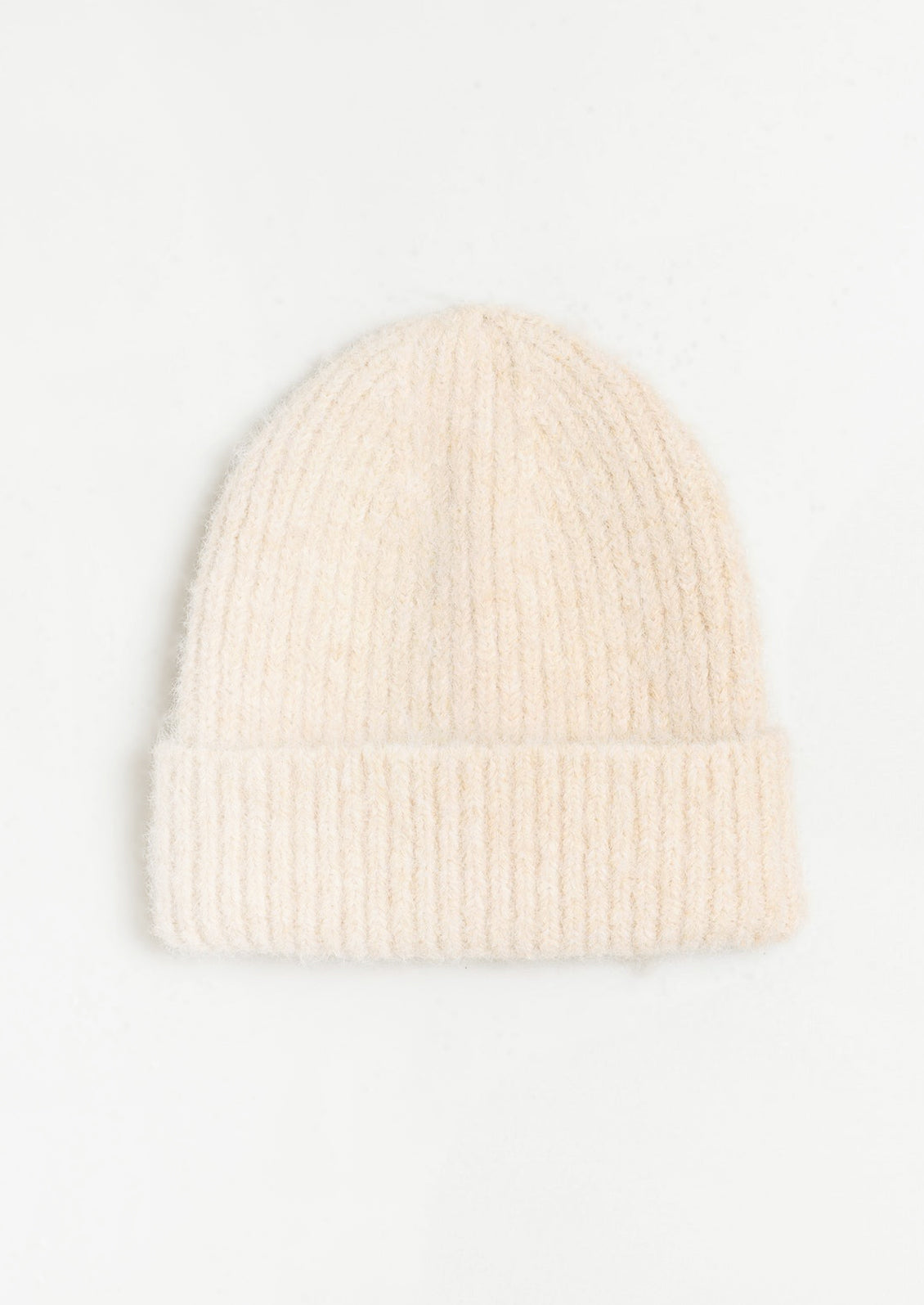 A fuzzy mohair beanie in cream.