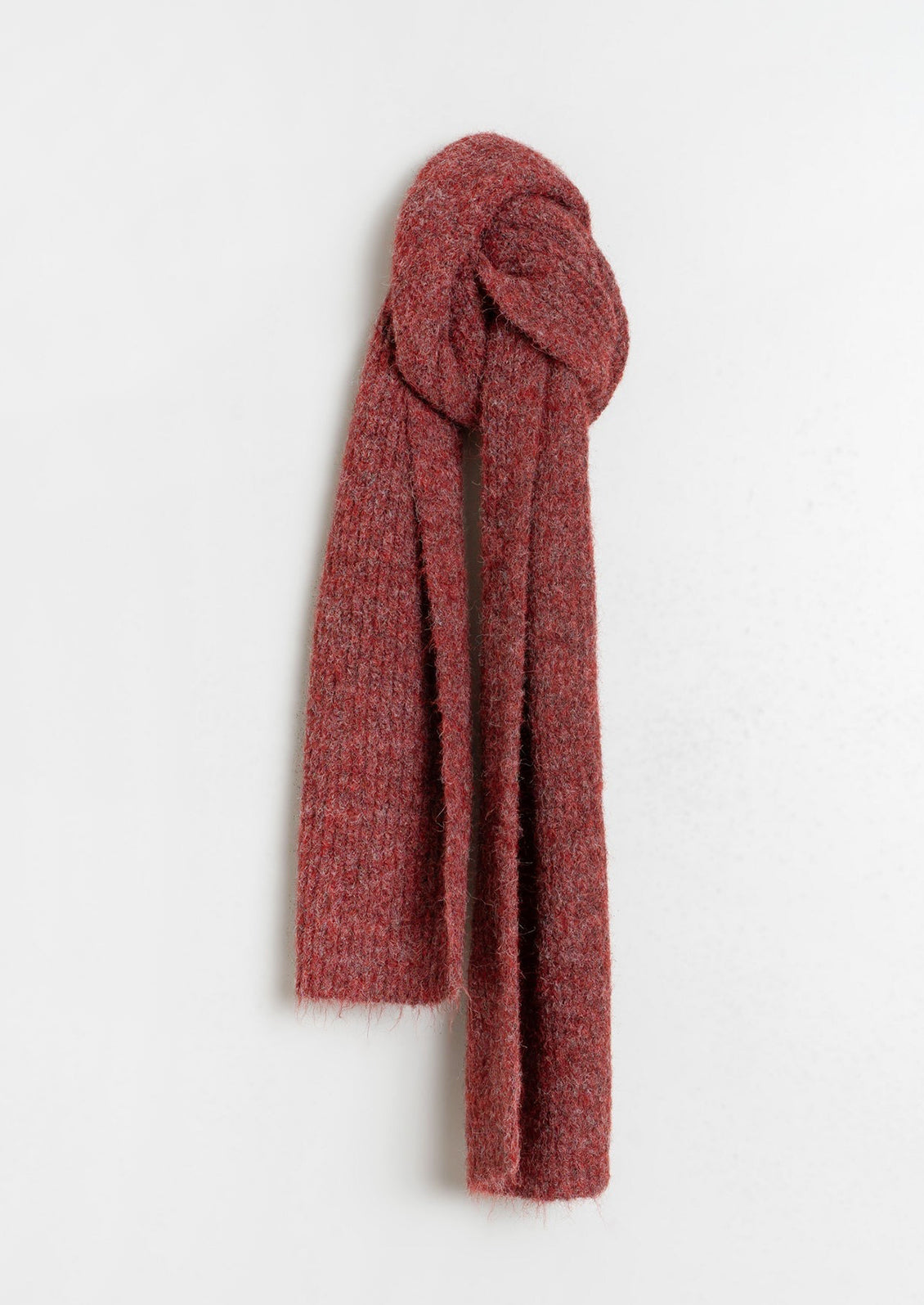 A fuzzy scarf in wine red.