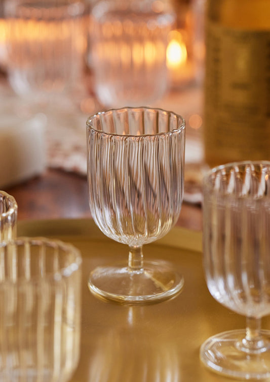 Fluted clear glass stemmed cups.