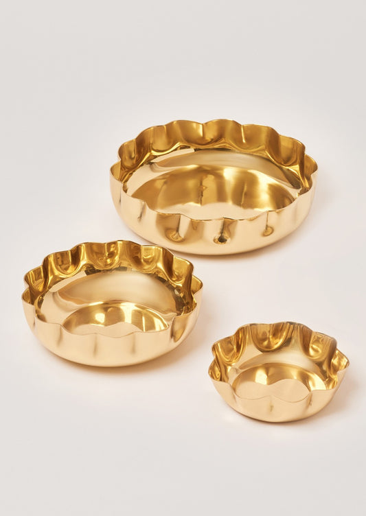 Round scalloped brass bowls in three sizes.