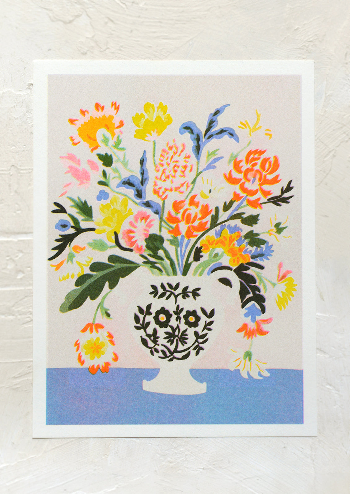 A risograph art print of colorful neon flowers in vase.