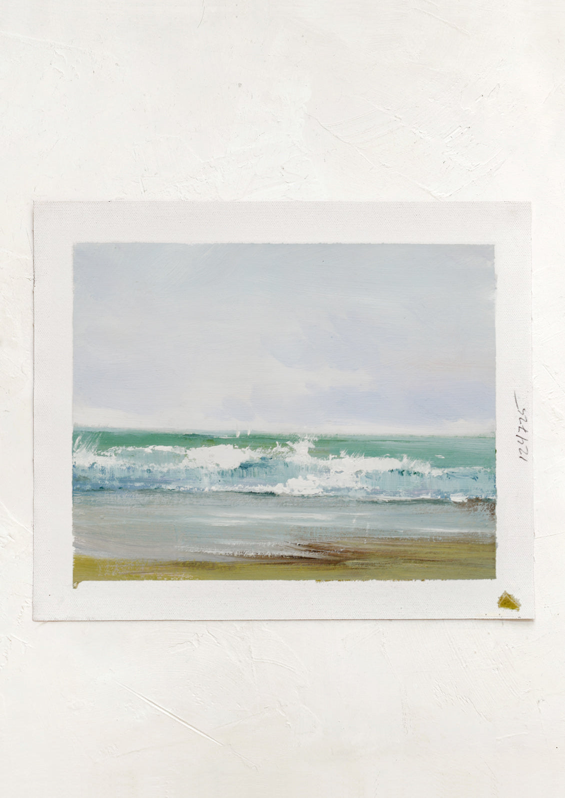 An original oil painting of waves on a beach.