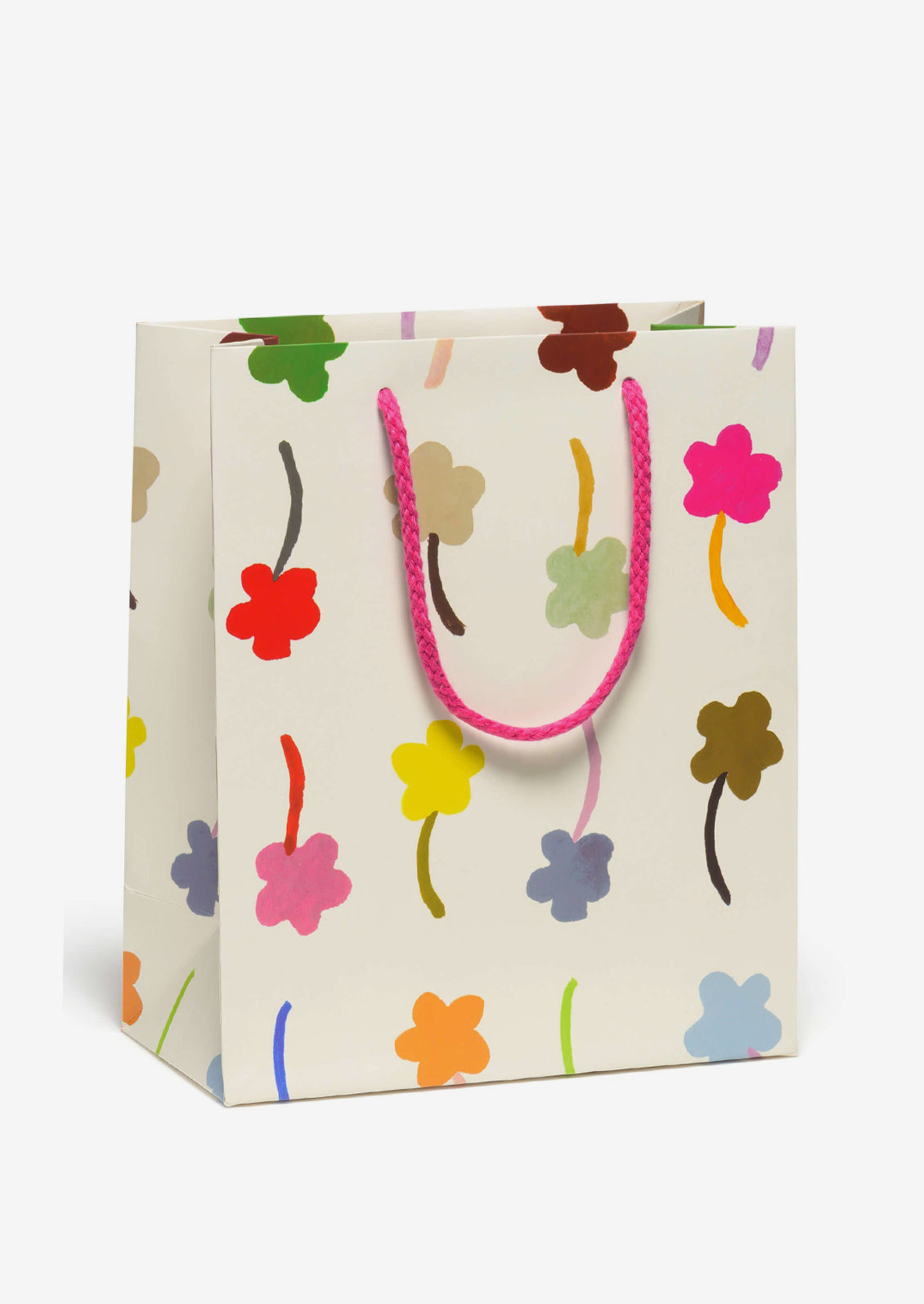 A printed gift bag with multicolor flower print on white background.