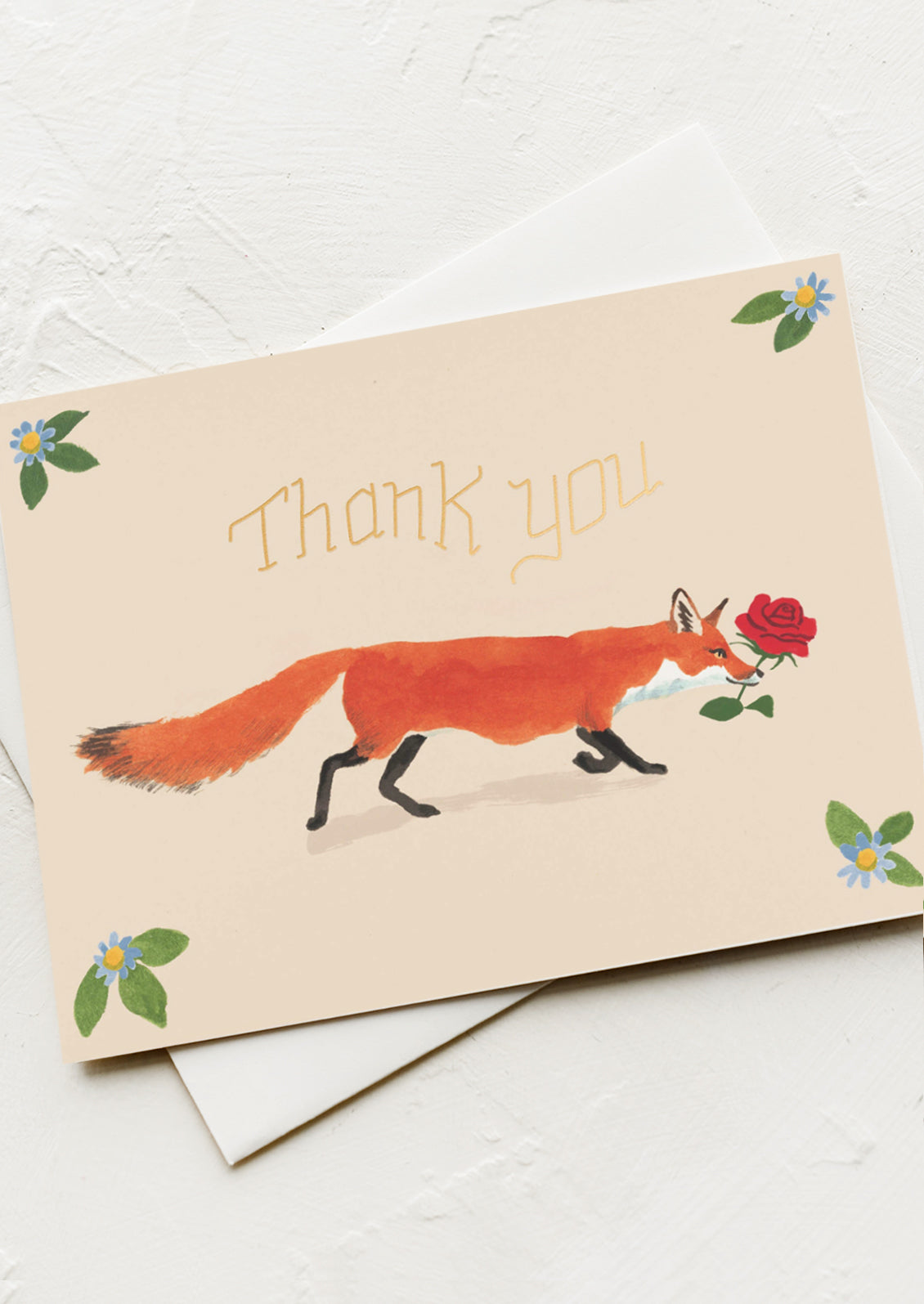 A card with illustration of fox holding red rose in its mouth, text reads "Thank you".