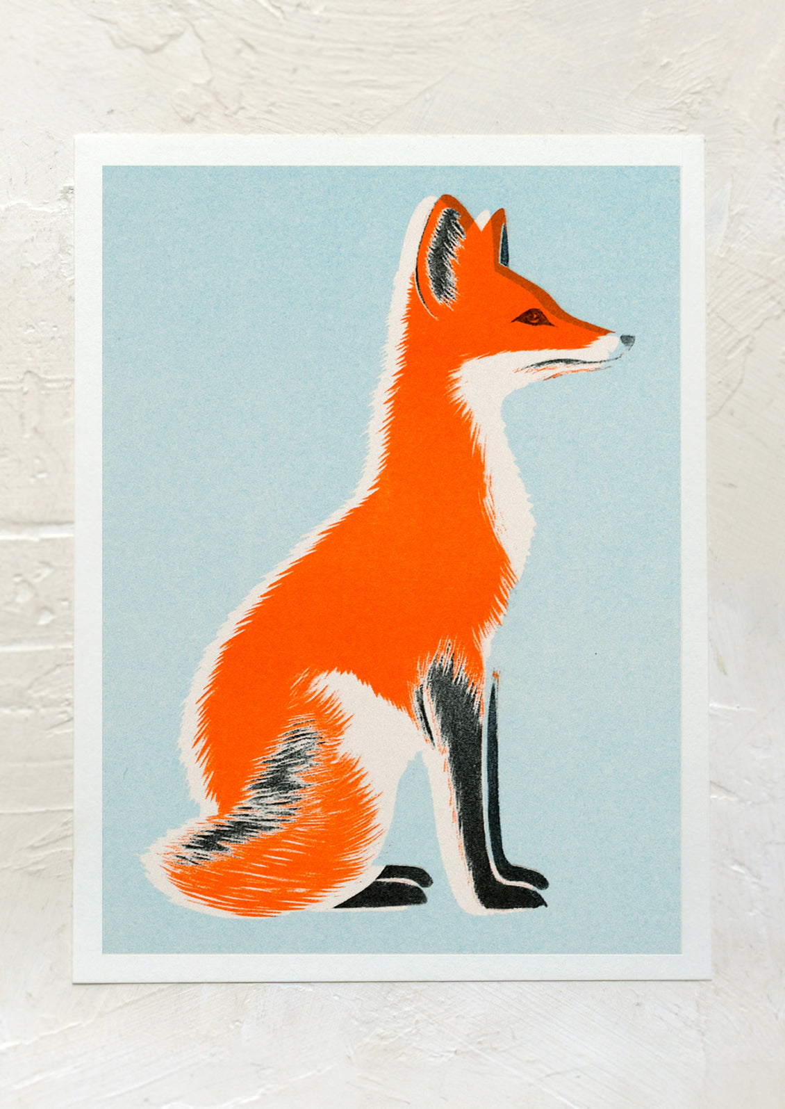 A risograph art print of neon orange fox on blue background.