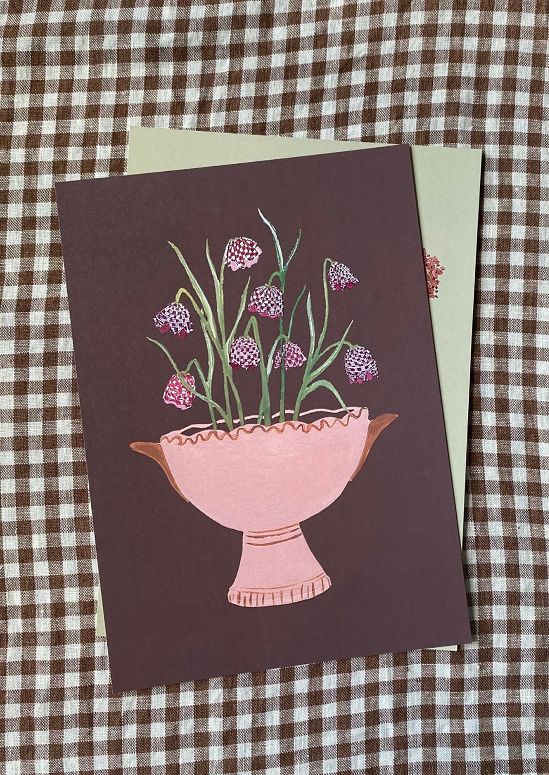 An art print of illustration of frittalaria flowers in pink pot, on dark brown background.