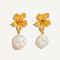 2: A pair of earrings with three dimensional gold flower post and dangling baroque pearl.