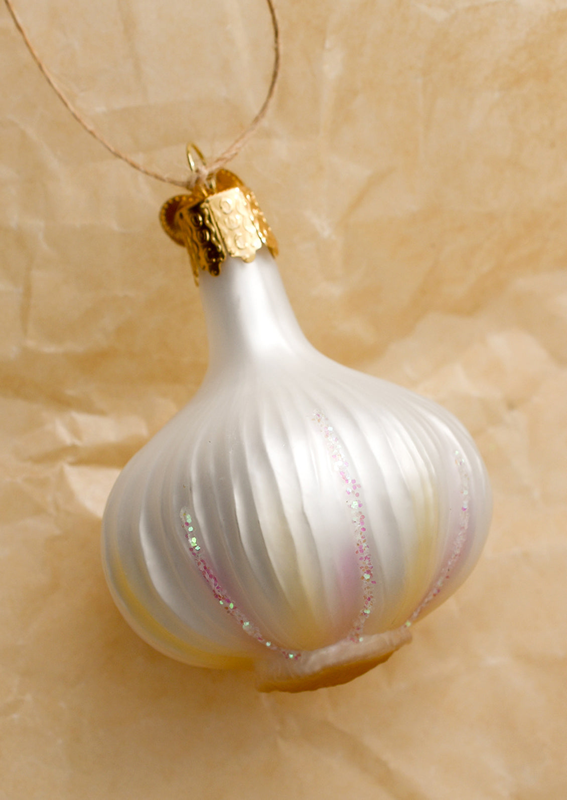 A glass ornament of a bulb of garlic.