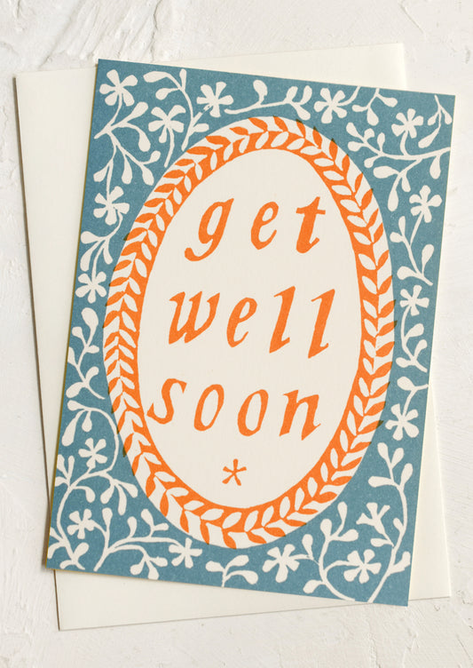 A floral print card reading "Get well soon".