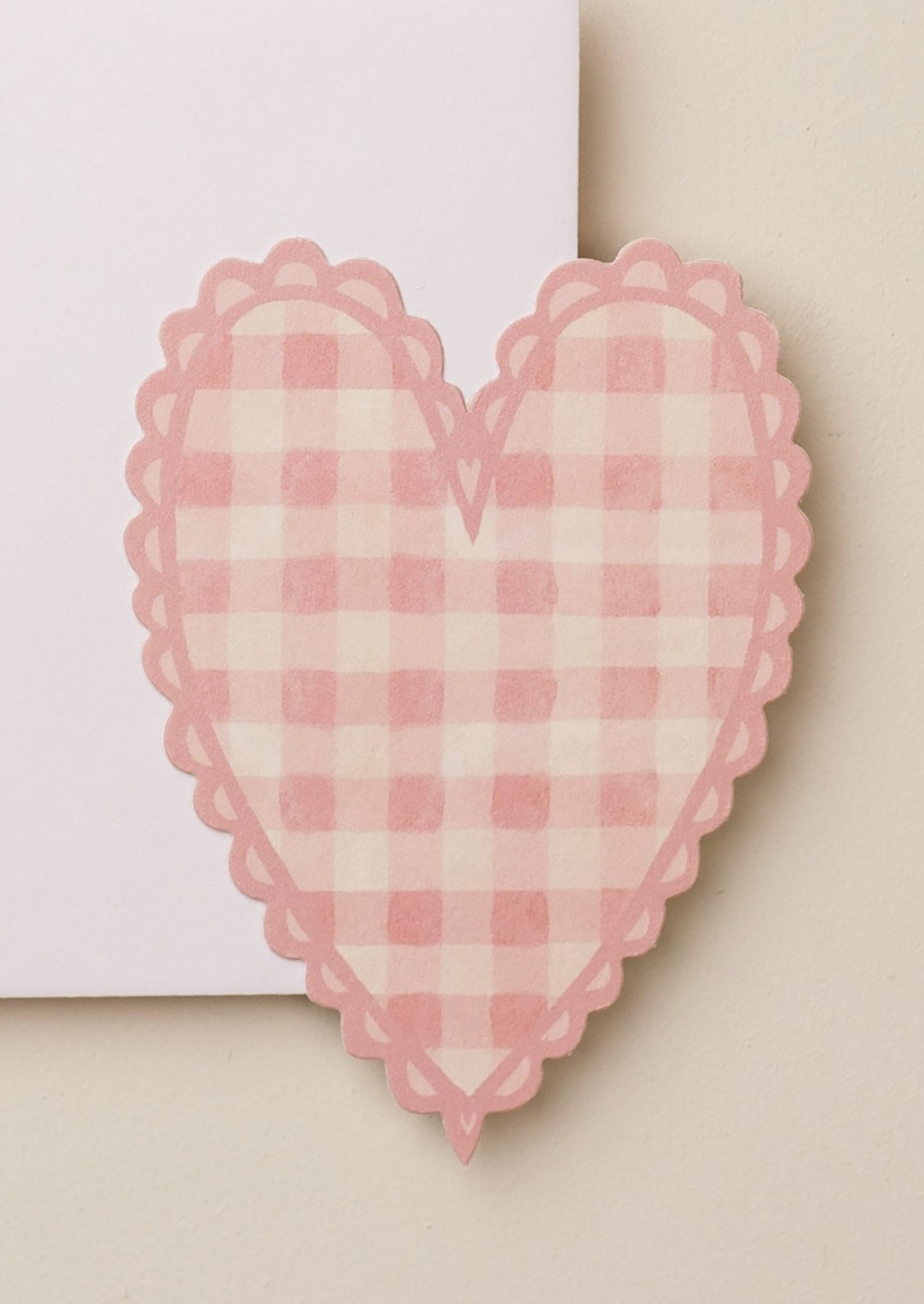 A heart shaped card in pink gingham print.