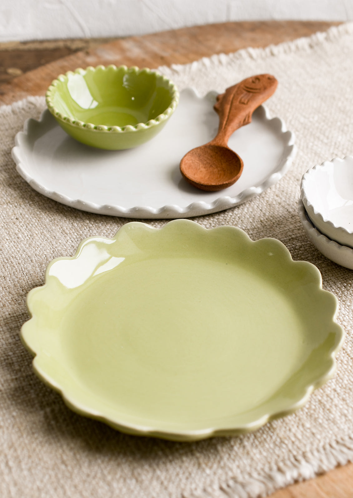 Assorted ceramics in white and green.